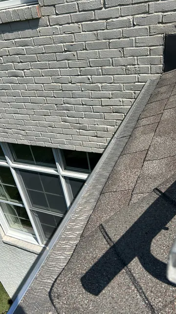 Guard beside a brick wall