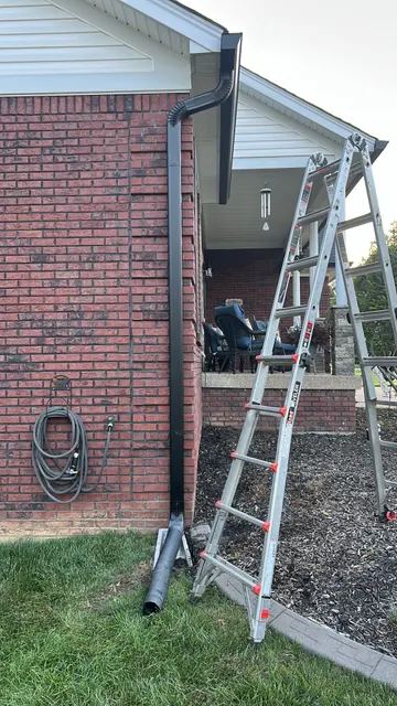 Downspout on a brick exterior