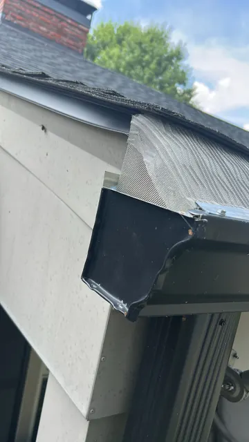 Gutter corner and downspout connection