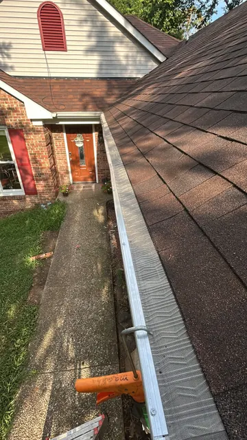 Gutter beside a metal roof