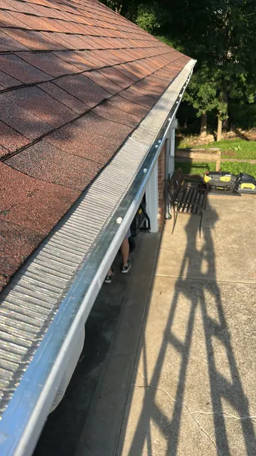 Guard along a metal roof