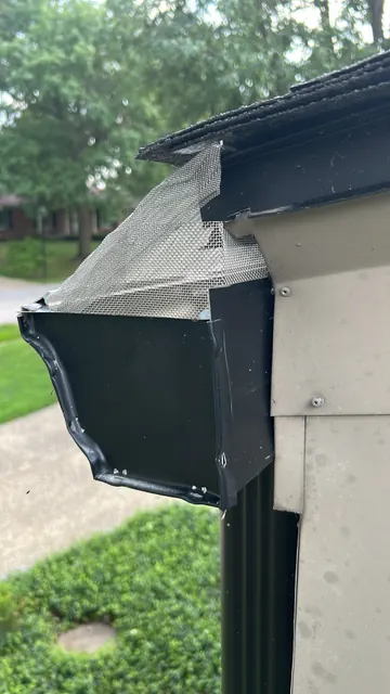 Gutter end and downspout