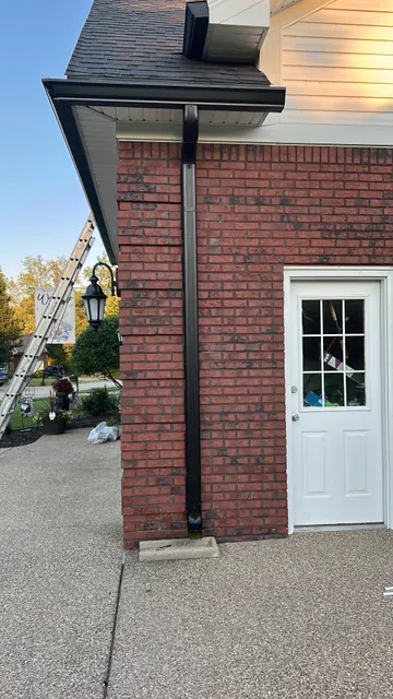Downspout on a brick wall